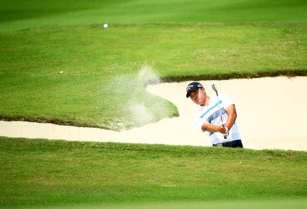 HAIKOU, CHINA - APRIL 04: (CHINA OUT) John Young Kim of United States plays a shot during the third round of China Tour - PGA Golf Herren Tour China Series Buick Open at Sandbelt Trails Golf Course on April 4, 2015 in Haikou, Hainan province of China.  CFP465537841 