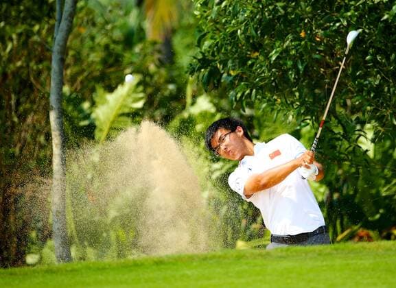 HAIKOU, CHINA - APRIL 04: (CHINA OUT) Dou Ze-cheng of China plays a shot during the third round of China Tour - PGA Golf Herren Tour China Series Buick Open at Sandbelt Trails Golf Course on April 4, 2015 in Haikou, Hainan province of China.  CFP465537843 
