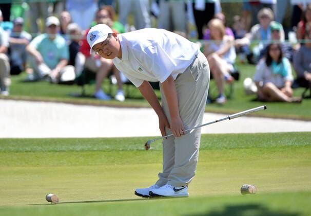 Samuel Pyon reacts after missing a putt during the Drive, Chip and Putt National Finals during Masters week at Augusta, National in Augusta, Georgia on April 5, 2015.  WAP20150405307 KEVINxDIETSCH