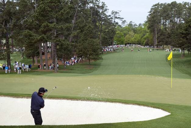 Graeme McDowell hits out of a bunker on the 7th hole during a practice round prior to the 2015 Masters Tournament at Augusta, National in Augusta, Georgia on April 6, 2015. The Masters will start on Thursday, April 9.  AUG20150406314 KEVINxDIETSCH