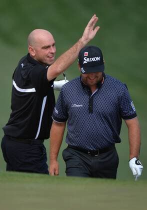 Thomas Bjorn playfully hits Graeme McDowell on the head on the 7th green during a practice round prior to the 2015 Masters Tournament at Augusta, National in Augusta, Georgia on April 6, 2015. The Masters will start on Thursday, April 9.  AUG20150406317 KEVINxDIETSCH