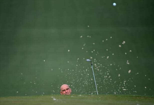 Thomas Bjorn hits out of a bunker on the 7th fairway during a practice round prior to the 2015 Masters Tournament at Augusta, National in Augusta, Georgia on April 6, 2015. The Masters will start on Thursday, April 9.  AUG20150406318 KEVINxDIETSCH