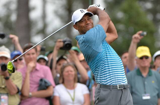 Tiger Woods watches his drive off of the 1st tee during a practice round prior to the 2015 Masters Tournament at Augusta, National in Augusta, Georgia on April 6, 2015.  AUG20150406322 KEVINxDIETSCH