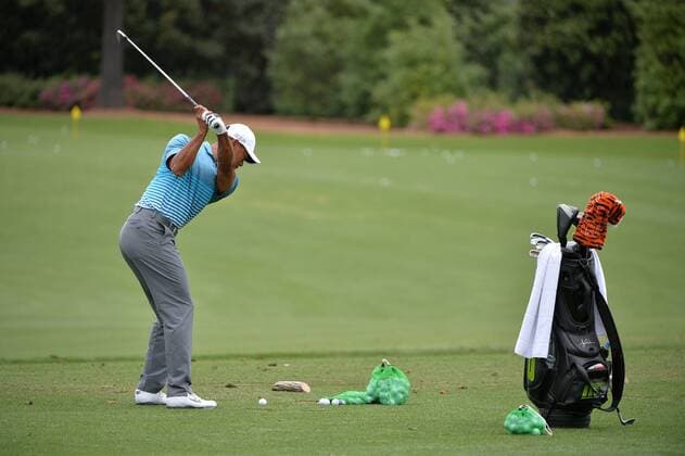 Tiger Woods hits on the practice range during a practice round prior to the 2015 Masters Tournament at Augusta, National in Augusta, Georgia on April 6, 2015.  AUG20150406329 KEVINxDIETSCH