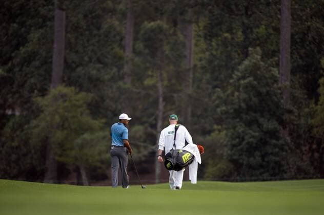 Tiger Woods and his caddy Joe LaCava walk down the 10th fairway during a practice round prior to the 2015 Masters Tournament at Augusta, National in Augusta, Georgia on April 6, 2015.  AUG20150406339 KEVINxDIETSCH