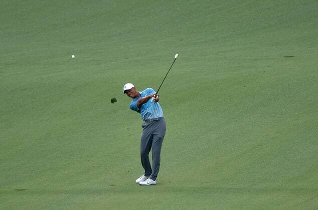 Tiger Woods hits on the 9th fairway during a practice round prior to the 2015 Masters Tournament at Augusta, National in Augusta, Georgia on April 6, 2015.  AUG20150406342 KEVINxDIETSCH