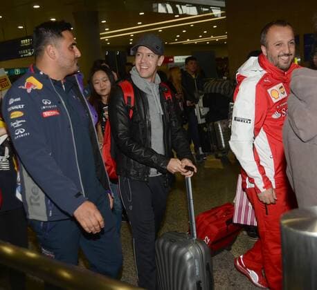 German F1 driver Sebastian Vettel of Ferrari, center, talks with staff of Red Bull Racing after arriving at the Shanghai Pudong International Airport in Shanghai, China, 8 April 2015. Sebastian Vettel receives warm welcome in Shanghai  pbu255937_19