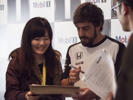 Spanish F1 driver Fernando Alonso of McLaren Honda, center, signs autographs for fans at a fan meeting event in Shanghai, China, 8 April 2015. Fernando Alonso heats up fan meeting event in Shanghai  pbu256095_07