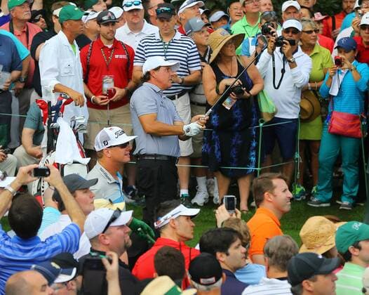 April 8, 2015 - Augusta, GA, USA - Phil Mickelson is surrounded by a large gallery as he tees off on the 16th hole during his practice round on Wednesday, April 8, 2015, at Augusta National Golf Club in Augusta, Ga. Masters practice April 8 - ZUMAm67_