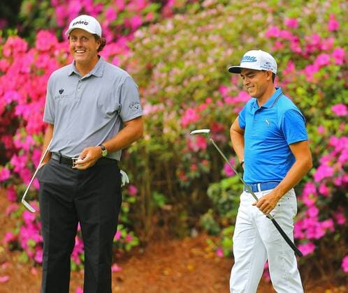 April 8, 2015 - Augusta, GA, USA - Phil Mickelson, left, and Rickie Fowler share a laugh on the 13th green during their practice round on Wednesday, April 8, 2015, at Augusta National Golf Club in Augusta, Ga. Masters practice April 8 - ZUMAm67_