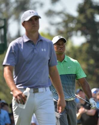 Tiger Woods (R) and Jordan Spieth walk off of the 18th tee box during a practice round at the 2015 Masters Tournament at Augusta, National in Augusta, Georgia on April 8, 2015.  AUG20150408319 KEVINxDIETSCH