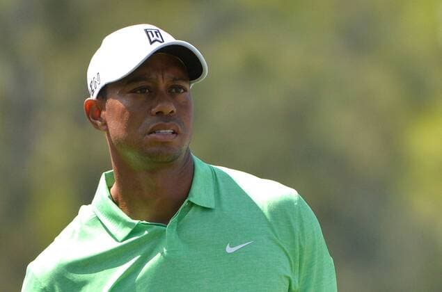 Tiger Woods watch his drive off of the 18th tee during a practice round at the 2015 Masters Tournament at Augusta, National in Augusta, Georgia on April 8, 2015.  AUG20150408320 KEVINxDIETSCH