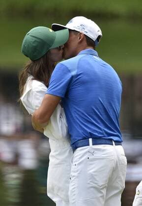 Rickie Fowler kisses his girlfriend Quail Hollow on the 9th green during the Par 3 contest at the 2015 Masters Tournament at Augusta, National in Augusta, Georgia on April 8, 2015.  AUG20150408373 KEVINxDIETSCH