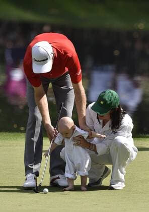 Brendon Todd and his wife Rachel Todd help their son Oliver putt on the 9th green during the Par 3 contest at the 2015 Masters Tournament at Augusta, National in Augusta, Georgia on April 8, 2015.  AUG20150408375 KEVINxDIETSCH