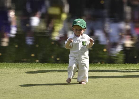 Chris Kirk s son Sawyer walks on the 9th green during the Par 3 contest at the 2015 Masters Tournament at Augusta, National in Augusta, Georgia on April 8, 2015.  AUG20150408376 KEVINxDIETSCH