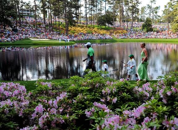April 8, 2015 - Augusta, Georgia, U.S. - TIGER WOODS, left, leads his son CHARLIE, daughter SAM and partner LINDSEY VONN past the azaleas toward the ninth green during the Par 3 contest on Wednesday at Augusta National Golf Club. Golf 2015 - The Masters - Practice Round - ZUMAm67_
