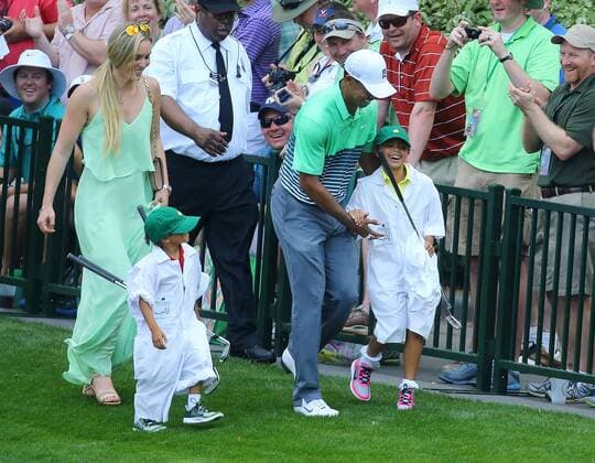 April 8, 2015 - Augusta, Georgia, U.S. - TIGER WOODS tickles his daughter SAM as his son CHARLIE and LINDSEY VONN look on walking past the gallery on the ninth fairway during the Par 3 Contest on Wednesday at Augusta National Golf Club. Golf 2015 - The Masters - Practice Round - ZUMAm67_