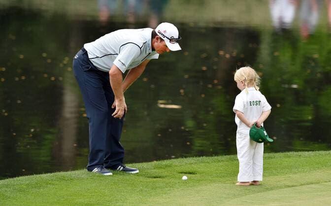 April 8, 2015 - Augusta, GA, USA - Justin Rose and his daughter, Lottie, checks his shot during the Par 3 Contest on Wednesday, April 8, 2015, at Augusta National Golf Club in Augusta, Ga. Masters practice April 8 - ZUMAm67_