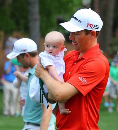 April 8, 2015 - Augusta, GA, USA - Brendon Todd walks down the first fairway with his baby boy Oliver during the Par 3 Contest on Wednesday, April 8, 2015, at Augusta National Golf Club in Augusta, Ga. Masters practice April 8 - ZUMAm67_