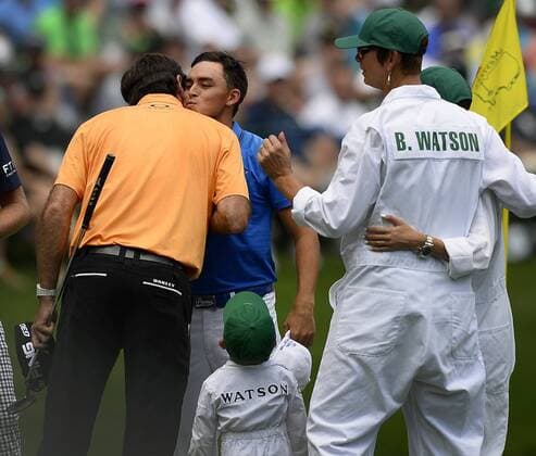 April 8, 2015 - Augusta, GA, USA - Bubba Watson, left, and Rickie Fowler, center, jokingly embrace following play in the Par 3 Contest on Wednesday, April 8, 2015, at Augusta National Golf Club in Augusta, Ga. Masters practice April 8 - ZUMAm67_