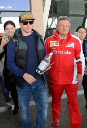 Finnish F1 driver Kimi Raikkonen of Ferrari, left, is pictured after arriving at the Shanghai Pudong International Airport in Shanghai, China, 9 April 2015. Kimi Raikkonen receives warm welcome in Shanghai  pbu256432_26