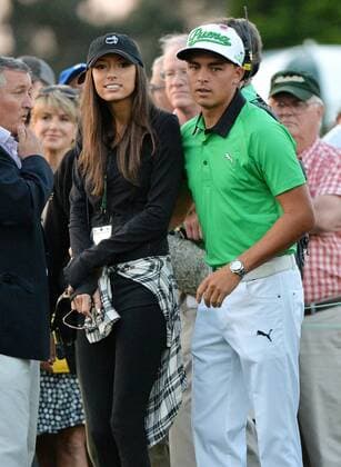 Rickie Fowler and Alexis Randrock stand at the first tee box at hole 1 at the start of the 2015 Masters Tournament at Augusta National Golf Club in Augusta, Georgia on April 9, 2015.  MAS20150409125 KEVINxDIETSCH