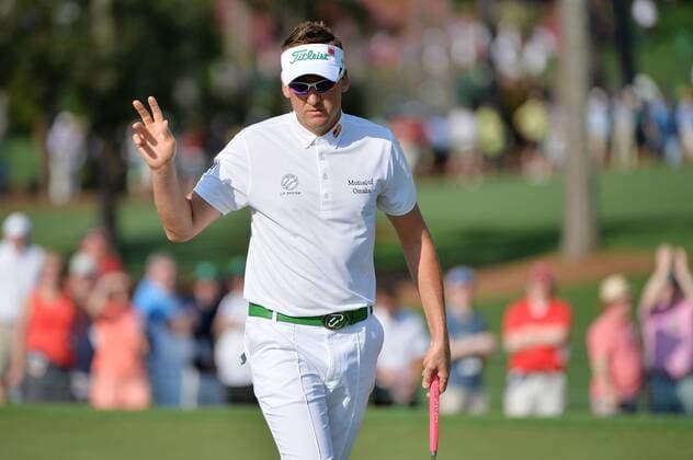 Ian Poulter from England reacts after sinking a birdie putt on the second green in the first round of the 2015 Masters Tournament at Augusta National Golf Club in Augusta, Georgia on April 9, 2015.  MAS20150409136 KEVINxDIETSCH