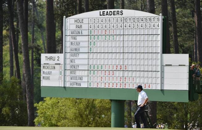 Phil Mickelson stands near the leaderboard on the third green in the first round of the 2015 Masters Tournament at Augusta National Golf Club in Augusta, Georgia on April 9, 2015.  MAS20150409150 KEVINxDIETSCH