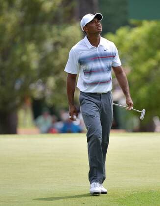 Tiger Woods reacts after putting on the third hole in the first round the 2015 Masters Tournament at Augusta National Golf Club in Augusta, Georgia on April 9, 2015.  MAS20150409173 KEVINxDIETSCH