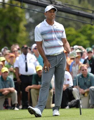 Tiger Woods stands on the tee box after his tee shot on the first hole in the first round the 2015 Masters Tournament at Augusta National Golf Club in Augusta, Georgia on April 9, 2015.  MAS20150409192 KEVINxDIETSCH