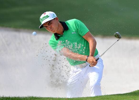 Rickey Fowler hits out of a bunker on the 10th hole in the first round the 2015 Masters Tournament at Augusta National Golf Club in Augusta, Georgia on April 9, 2015.  MAS20150409195 KEVINxDIETSCH