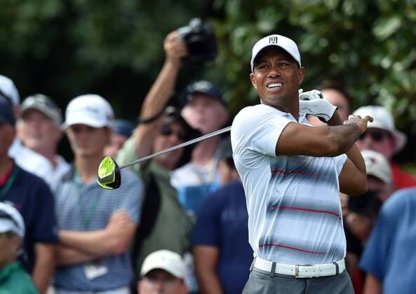 April 9, 2015 - Augusta, Georgia, U.S. - TIGER WOODS reacts as his ball veers off course on the 9 tee during the first round at the Masters Golf Tournament. Woods recovered and made par at No. 16 at the Masters. Golf 2015 - Masters Tournament - Round 1 - ZUMAm67_