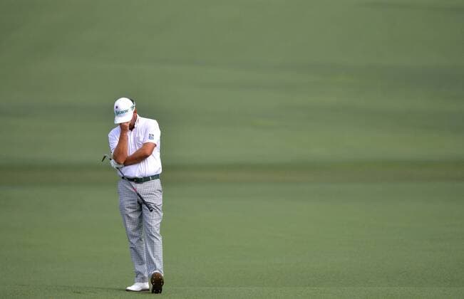 Graeme McDowell from Northern Ireland reacts after hitting his approach shot to the second green in the second round of the 2015 Masters Tournament at Augusta National Golf Club in Augusta, Georgia on April 10, 2015.  AUG20150410103A KEVINxDIETSCH