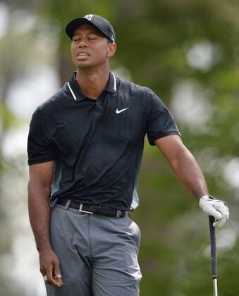 Tiger Woods reacts after his tee shot on the 4th hole in the second round of the 2015 Masters Tournament at Augusta National Golf Club in Augusta, Georgia on April 10, 2015.  AUG20150410127 KEVINxDIETSCH