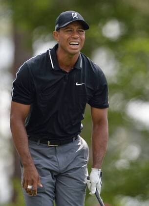 Tiger Woods reacts after his tee shot on the 4th hole in the second round of the 2015 Masters Tournament at Augusta National Golf Club in Augusta, Georgia on April 10, 2015.  AUG20150410128 KEVINxDIETSCH
