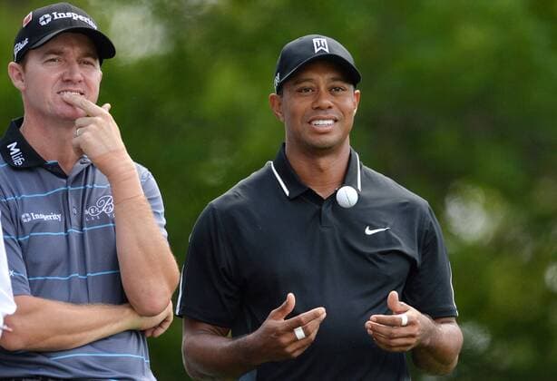 Tiger Woods smiles with Jimmy Walker on the 4th tee box in the second round of the 2015 Masters Tournament at Augusta National Golf Club in Augusta, Georgia on April 10, 2015.  AUG20150410132 KEVINxDIETSCH