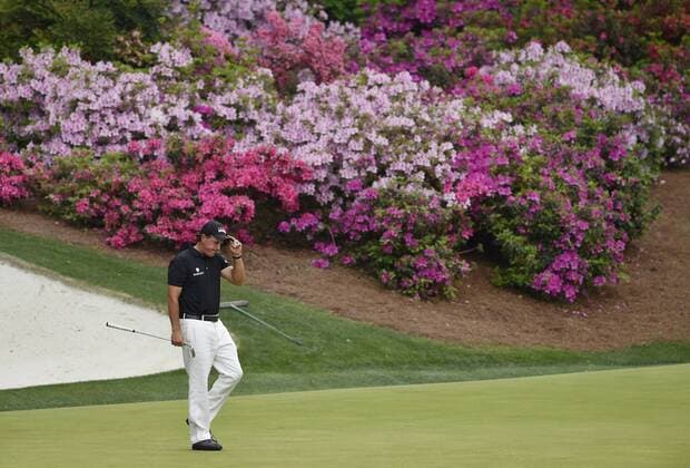 Phil Mickelson tips his hat after making a birdie on the 13th hole in the second round of the 2015 Masters Tournament at Augusta National Golf Club in Augusta, Georgia on April 10, 2015.  AUG20150410152 KEVINxDIETSCH