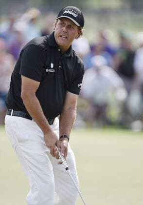 Phil Mickelson reacts after missing a putt on the 9th hole in the second round of the 2015 Masters Tournament at Augusta National Golf Club in Augusta, Georgia on April 10, 2015.  AUG20150410163 KEVINxDIETSCH