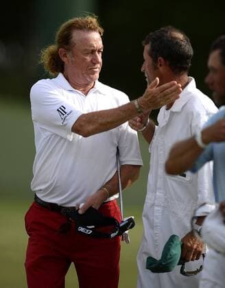 April 10, 2015 - Augusta, GA, USA - Miguel Angel Jimenez, left, pats a caddie on the cheek following play on the 18th green during the second round of the Masters at Augusta National Golf Club on Friday, April 10, 2015, in Augusta, Ga. Masters day 2 - ZUMAm67_