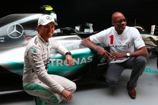 11.04.2015 - (L to R): Nico Rosberg (GER) Mercedes AMG F1 with Ed Moses (USA) 400m Hurdles Athletics Legend. Chinese Grand Prix, Shanghai 09 - 12 April 2015 