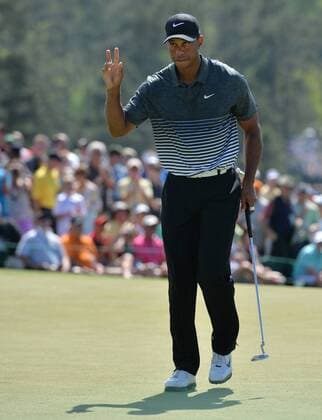 Tiger Woods reacts after making a long putt for par on the 9th hole in the third round of the 2015 Masters Tournament at Augusta National Golf Club in Augusta, Georgia on April 11, 2015.  AUG20150411110 KEVINxDIETSCH