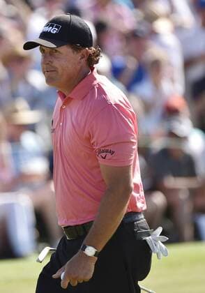 Phil Mickelson walks off of the 9th green after making a birdie in the third round of the 2015 Masters Tournament at Augusta National Golf Club in Augusta, Georgia on April 11, 2015.  AUG20150411118 KEVINxDIETSCH