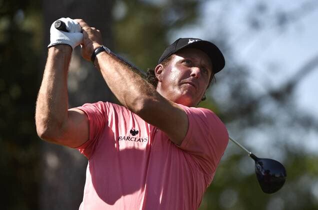 Phil Mickelson hits a tee shot on the 9th hole in the third round of the 2015 Masters Tournament at Augusta National Golf Club in Augusta, Georgia on April 11, 2015.  AUG20150411121 KEVINxDIETSCH