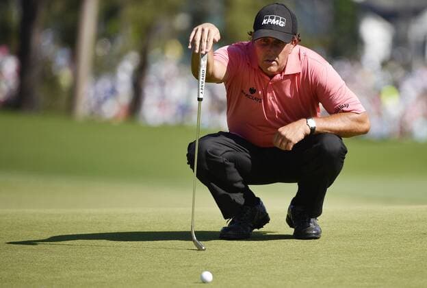 Phil Mickelson lines up a putt on the 8th hole in the third round of the 2015 Masters Tournament at Augusta National Golf Club in Augusta, Georgia on April 11, 2015.  AUG20150411122 KEVINxDIETSCH
