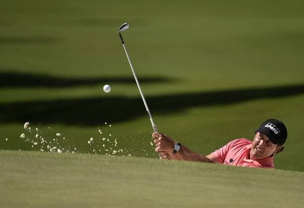 Phil Mickelson hits out of a bunker on the 7th hole in the third round of the 2015 Masters Tournament at Augusta National Golf Club in Augusta, Georgia on April 11, 2015.  AUG20150411125A KEVINxDIETSCH