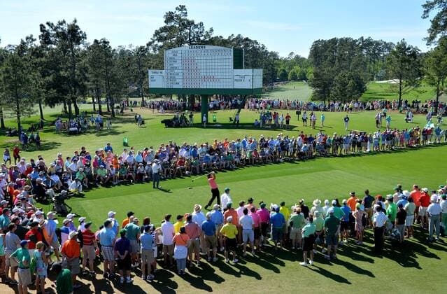 Patron watch Phil Mickelson hit his tee shot on the 8th hole in the third round of the 2015 Masters Tournament at Augusta National Golf Club in Augusta, Georgia on April 11, 2015.  AUG20150411130 KEVINxDIETSCH