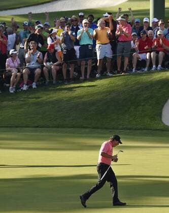 Patrons celebrate with Phil Mickelson after he makes a long putt for birdie on the 16th hole in the third round of the 2015 Masters Tournament at Augusta National Golf Club in Augusta, Georgia on April 11, 2015.  AUG20150411138 KEVINxDIETSCH