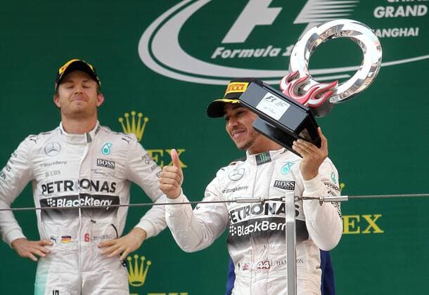 Britain s Lewis Hamilton of Mercedes poses with his champion trophy to celebrate his victory during the award ceremony of the 2015 Formula 1 Chinese Grand Prix at the Shanghai International Circuit in Shanghai, China, 12 April 2015. Lewis Hamilton put Mercedes back on top in Formula One, leading for most of the race on Sunday (12 April 2015) to capture his fourth Chinese Grand Prix victory. Hamilton made sure there would be no repeat of Ferrari s surprising win two weeks ago at the Malaysian Grand Prix, conserving his tires to withstand a challenge by the Italian team s Sebastian Vettel and easily capture the 35th win of his career. Hamilton s Mercedes teammate Nico Rosberg finished second and Vettel was third. Lewis Hamilton wins 4th Chinese Grand Prix  pbu258196_16