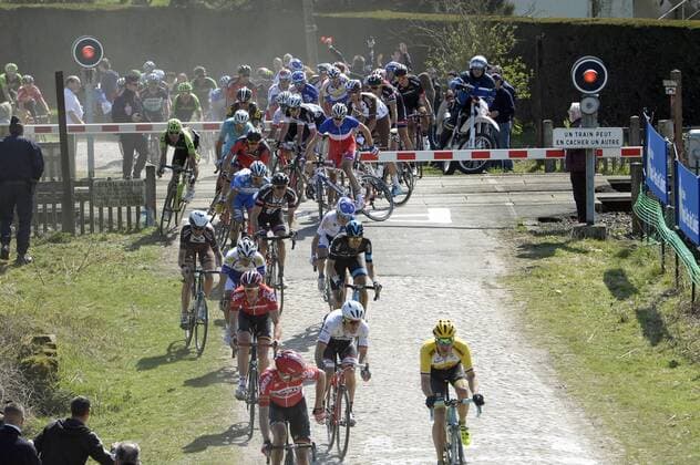 - ROUBAIX, FRANCE: Riders ride through a closed rail barrier at the Paris-Roubaix one day cycling race, 253,5 km from Compiegne to the Velodrome in Roubaix, Sunday 12 April 2015. DIRKxWAEM  x04603020x