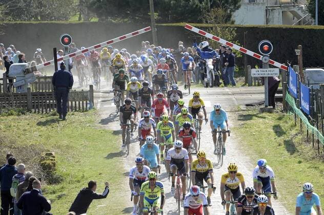 - ROUBAIX, FRANCE: Riders ride through a closing rail barrier at the Paris-Roubaix one day cycling race, 253,5 km from Compiegne to the Velodrome in Roubaix, Sunday 12 April 2015. DIRKxWAEM  x04603026x